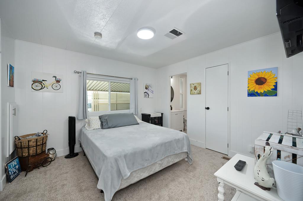 7512 Bufflehead Lane Citrus Heights, CA 95621 - Photo 34 of 52 a bedroom with a bed and wooden floor