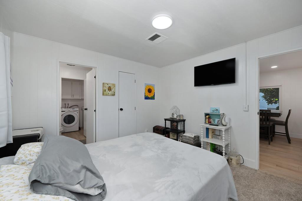 7512 Bufflehead Lane Citrus Heights, CA 95621 - Photo 35 of 52 a bedroom with a bed and a flat screen tv