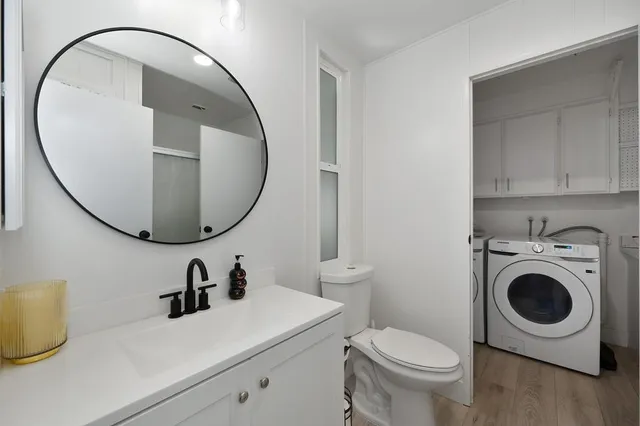 a bedroom with a bed and a television