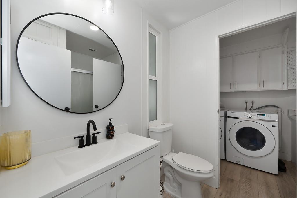 7512 Bufflehead Lane Citrus Heights, CA 95621 - Photo 37 of 52 a bathroom with a sink a toilet and a mirror