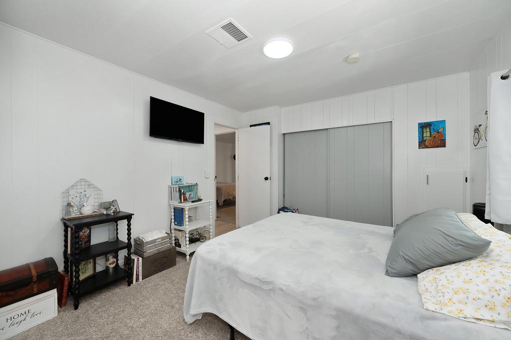 7512 Bufflehead Lane Citrus Heights, CA 95621 - Photo 38 of 52 a bedroom with a bed and a television