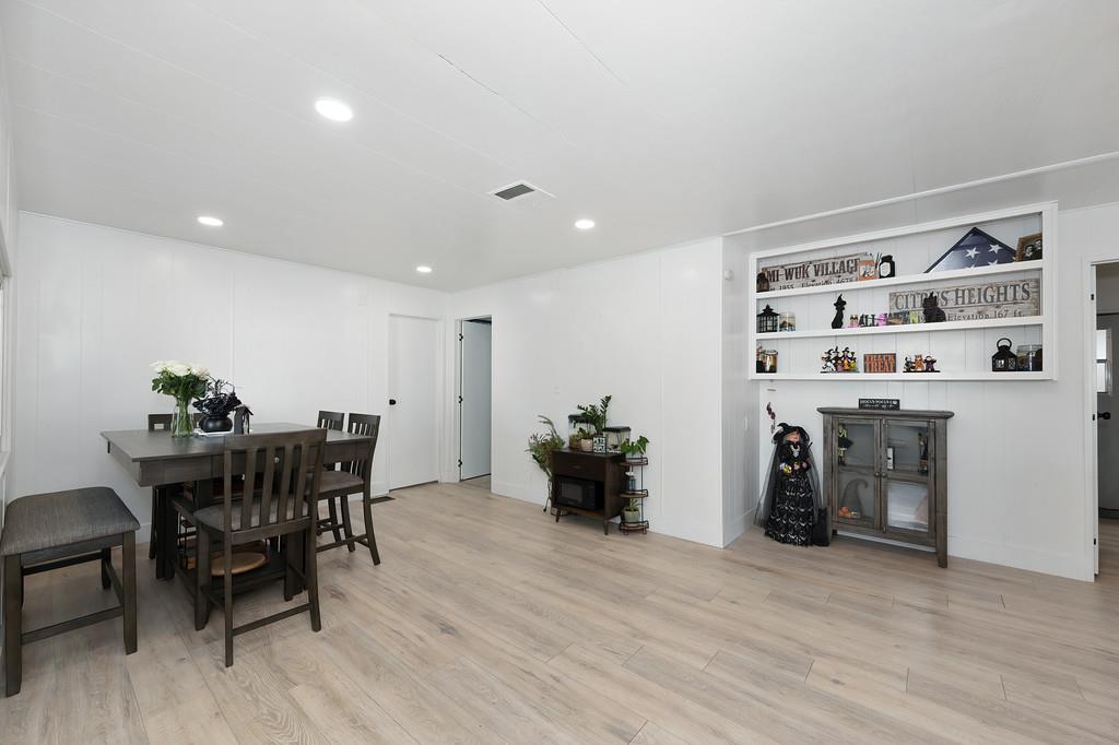 7512 Bufflehead Lane Citrus Heights, CA 95621 - Photo 42 of 52 a view of a dining room with furniture and wooden floor