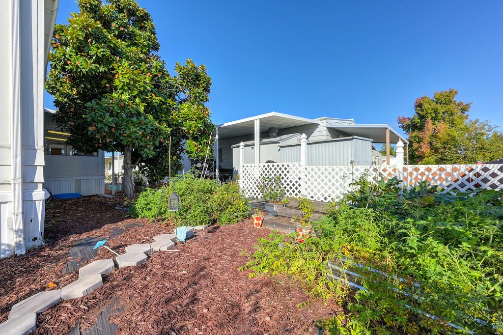 7512 Bufflehead Lane Citrus Heights, CA 95621 - Photo 47 of 52 a front view of a house with a yard