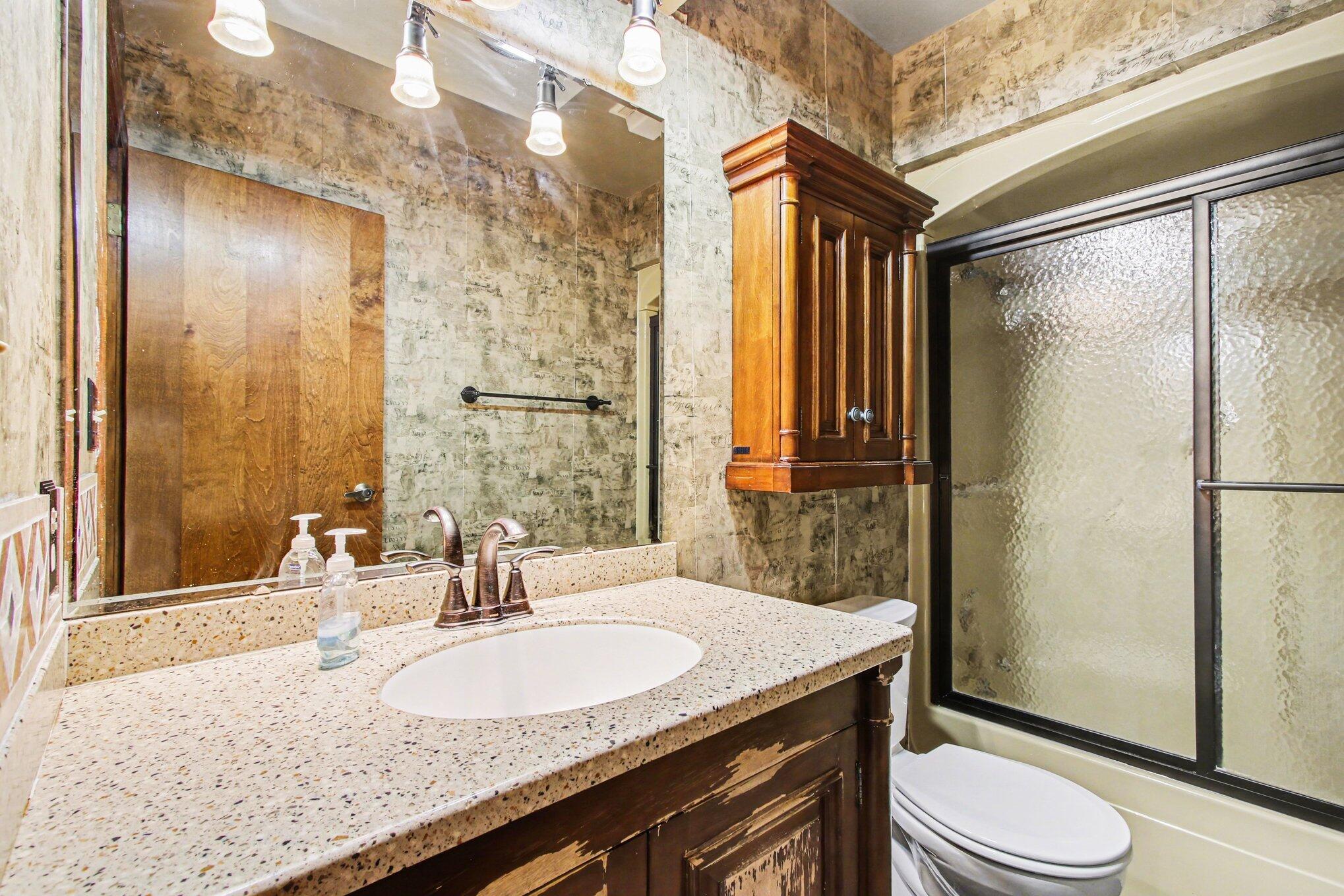 186 Wexford Road Valparaiso, IN 46385 - Photo 15 of 33 a bathroom with a granite countertop sink toilet and shower