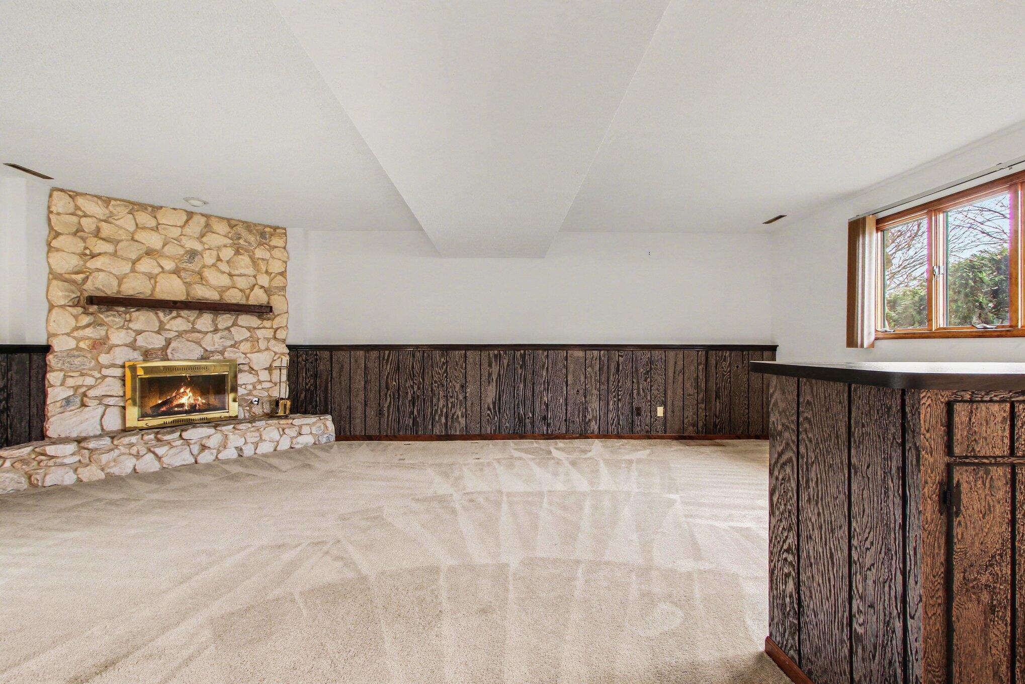 186 Wexford Road Valparaiso, IN 46385 - Photo 17 of 33 a view of an empty room with a fireplace and a window