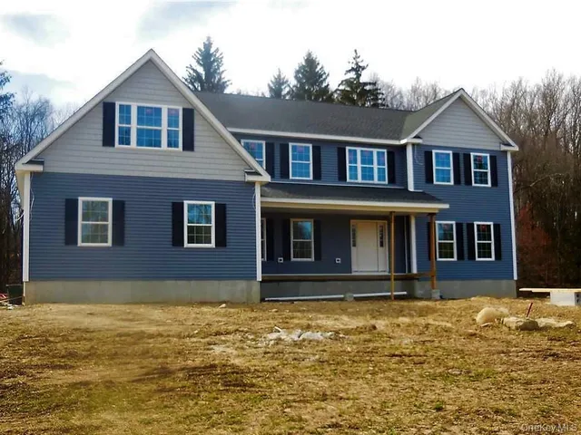 a front view of house with yard