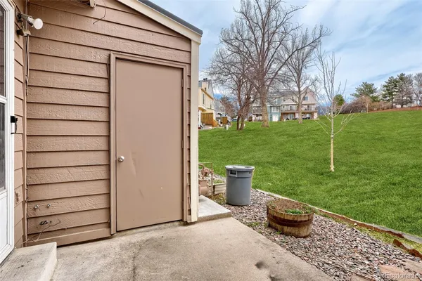 a view of backyard of house having outdoor seating
