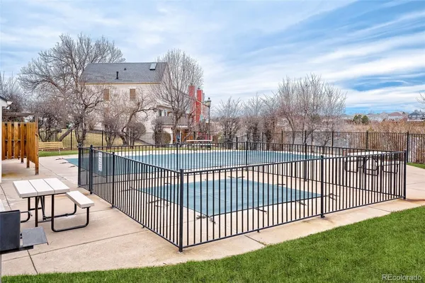 a view of a wrought iron fences in front of house