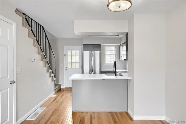 a view of kitchen island with furniture and wooden floor