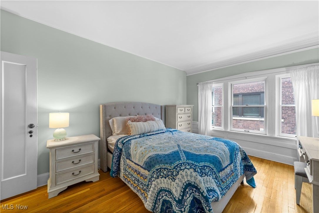 2472 Overlook Road, Unit 3 Cleveland, OH 44106 - Photo 9 of 11 Bedroom featuring hardwood / wood-style floors and baseboards