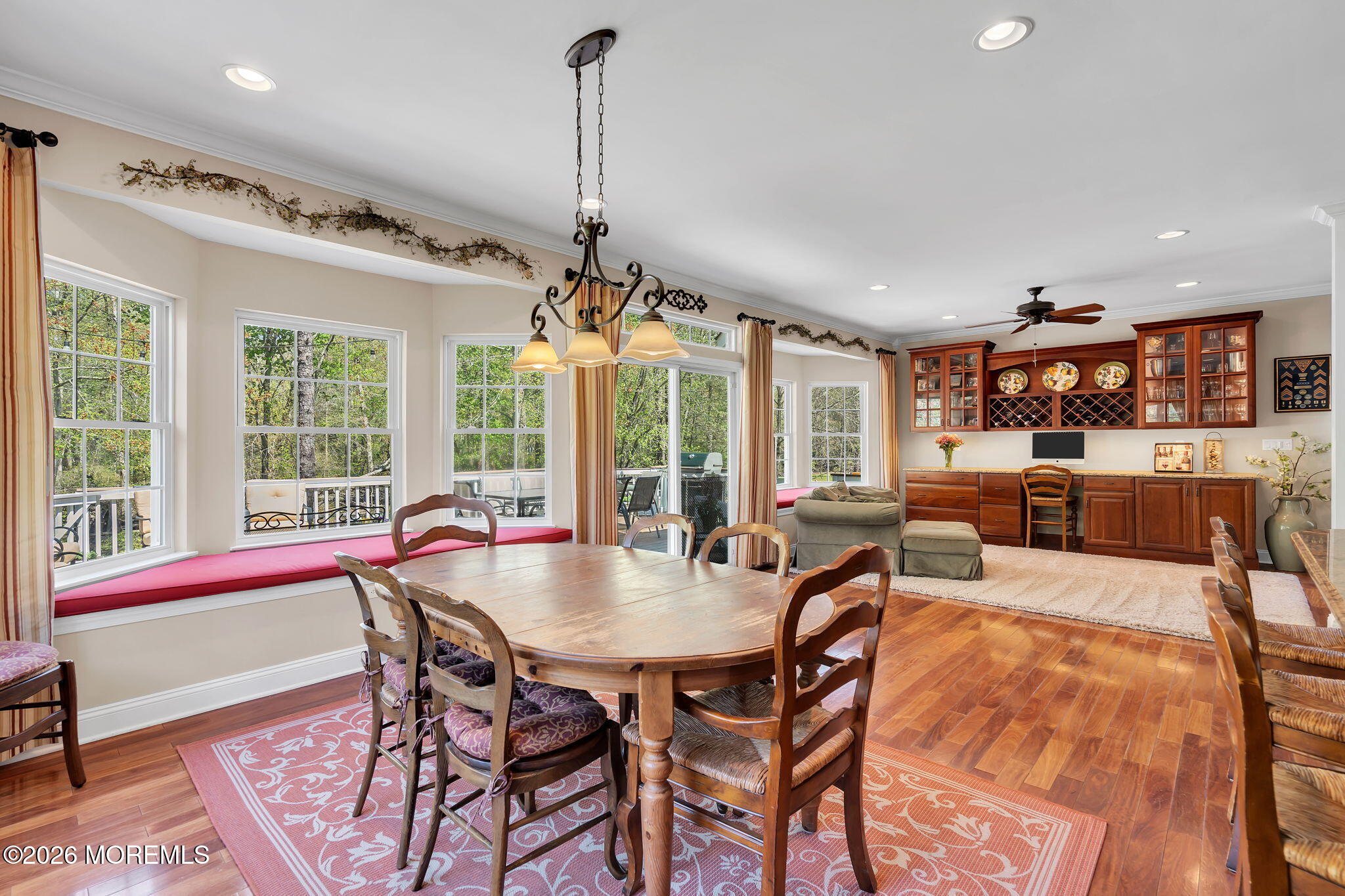 343 Nighthawk Lane Jackson, NJ 08527 - Photo 25 of 72 a view of a dining room and livingroom with furniture wooden floor a chandelier