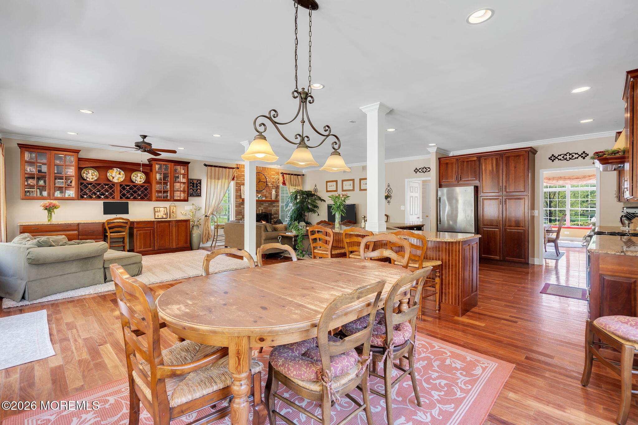343 Nighthawk Lane Jackson, NJ 08527 - Photo 26 of 72 a view of a dining room and livingroom with furniture wooden floor a chandelier