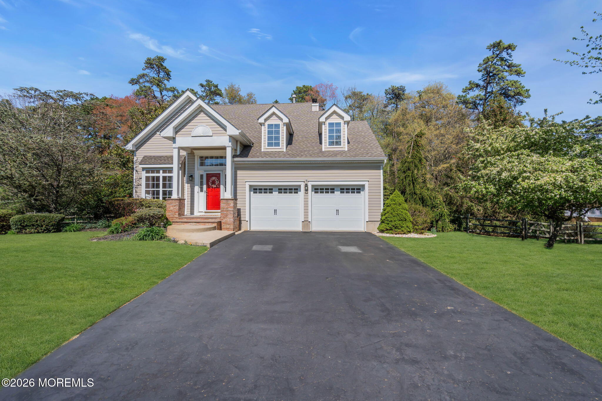 343 Nighthawk Lane Jackson, NJ 08527 - Photo 3 of 72 a front view of a house with a yard and garage