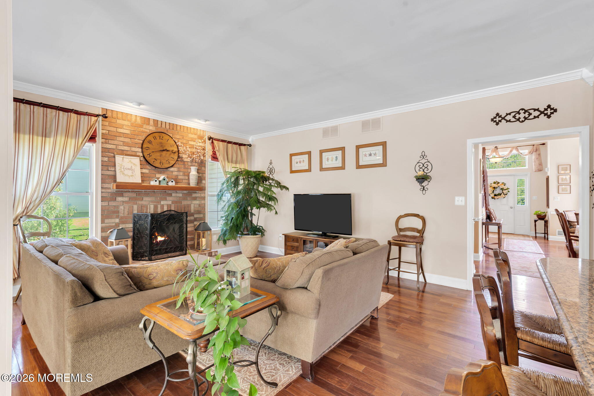 343 Nighthawk Lane Jackson, NJ 08527 - Photo 33 of 72 a living room with furniture a fireplace and a large window