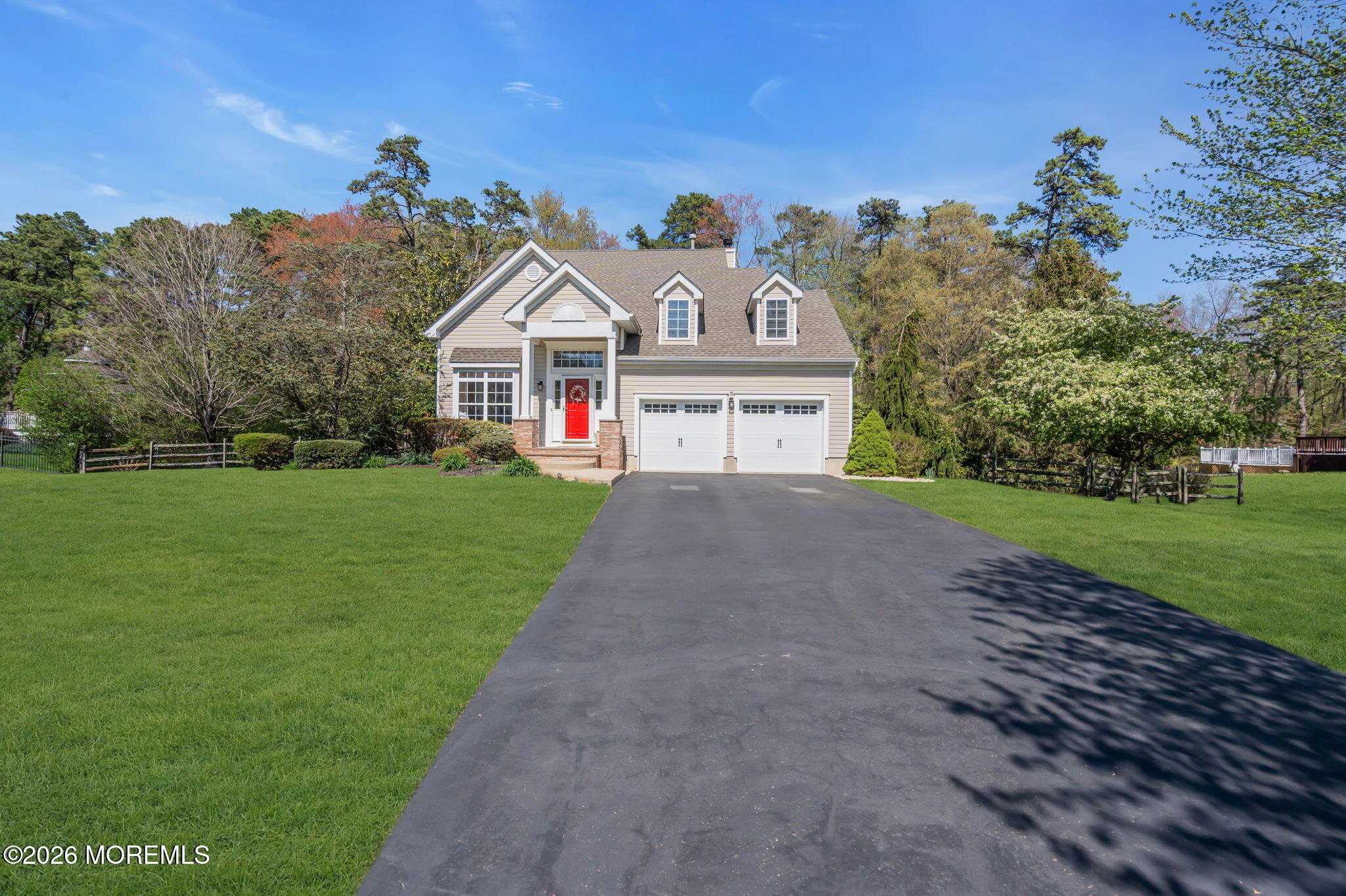 343 Nighthawk Lane Jackson, NJ 08527 - Photo 4 of 72 a view of a white house with a big yard and large trees