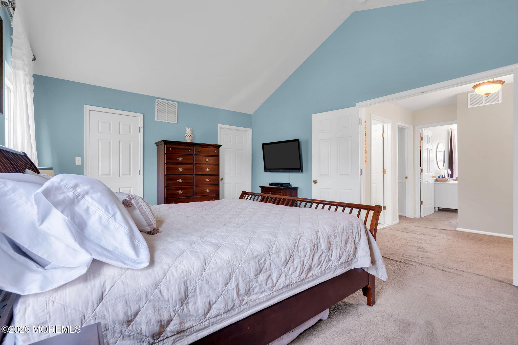 343 Nighthawk Lane Jackson, NJ 08527 - Photo 48 of 72 a bedroom with a bed and a flat tv screen on wall