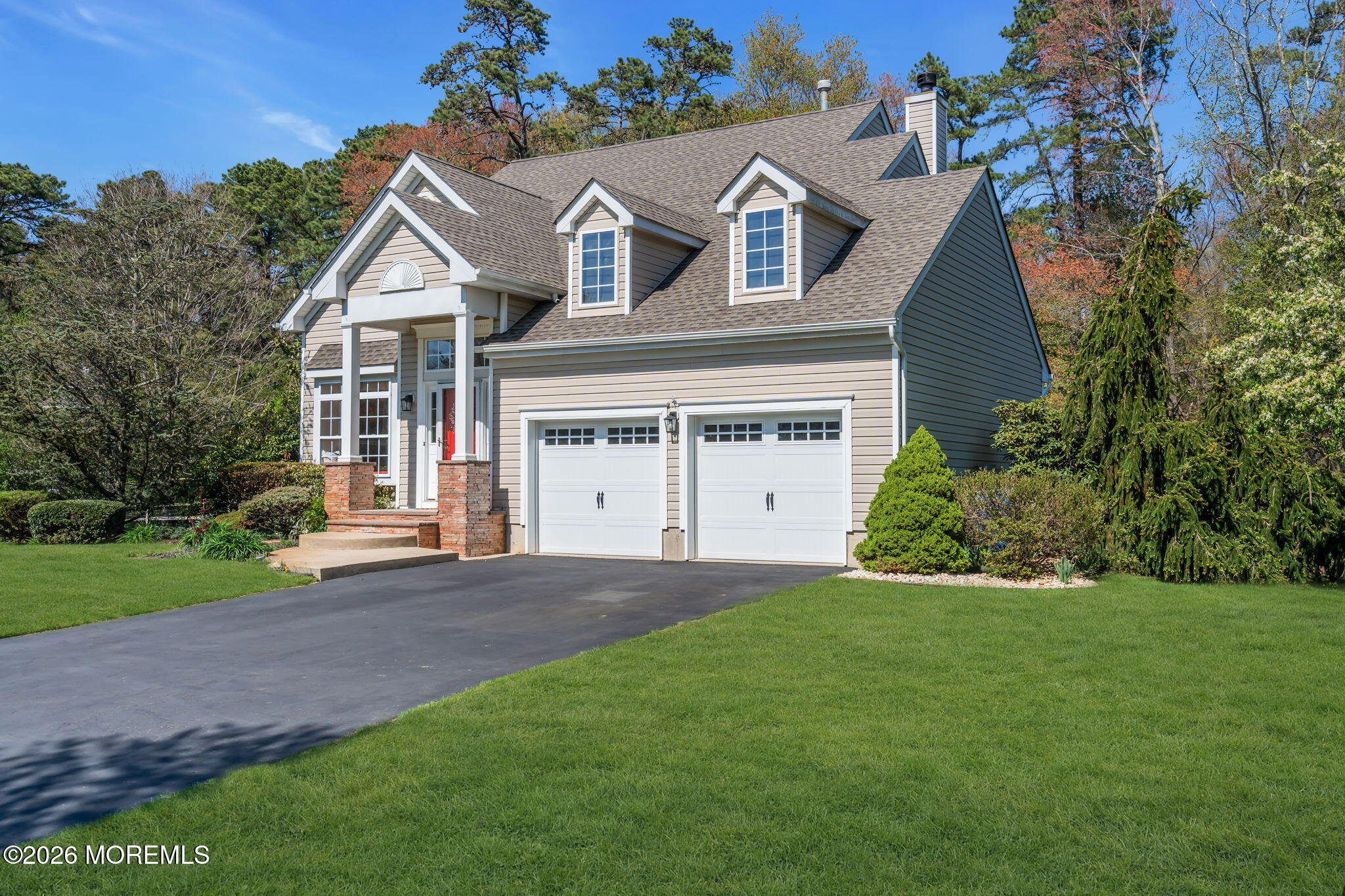 343 Nighthawk Lane Jackson, NJ 08527 - Photo 5 of 72 a front view of a house with a yard and garage