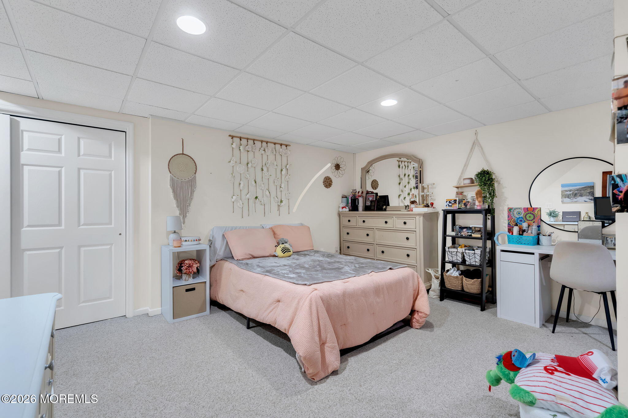 343 Nighthawk Lane Jackson, NJ 08527 - Photo 59 of 72 a spacious bedroom with a bed a dresser and book shelf