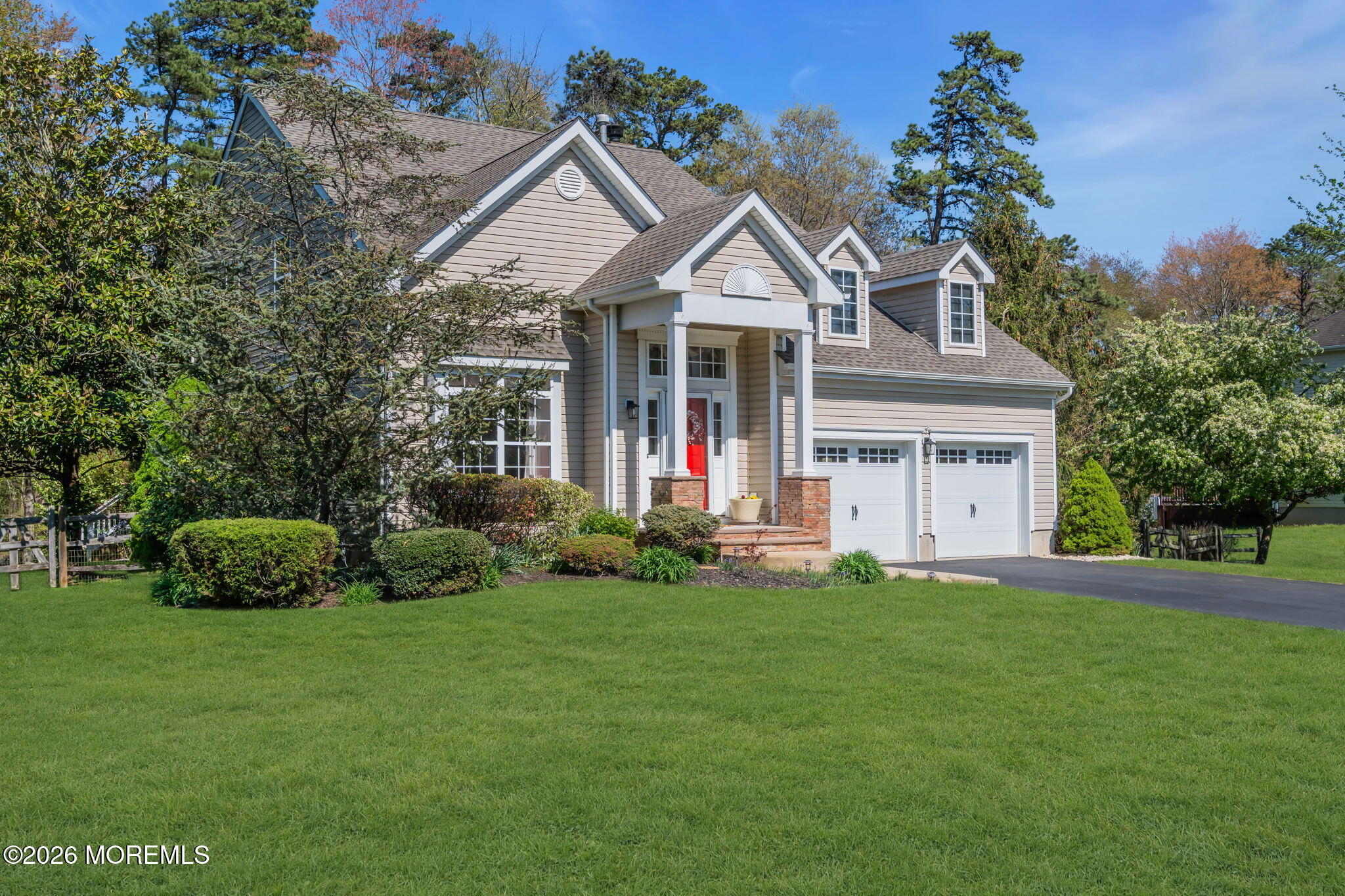 343 Nighthawk Lane Jackson, NJ 08527 - Photo 6 of 72 a front view of a house with a yard and trees