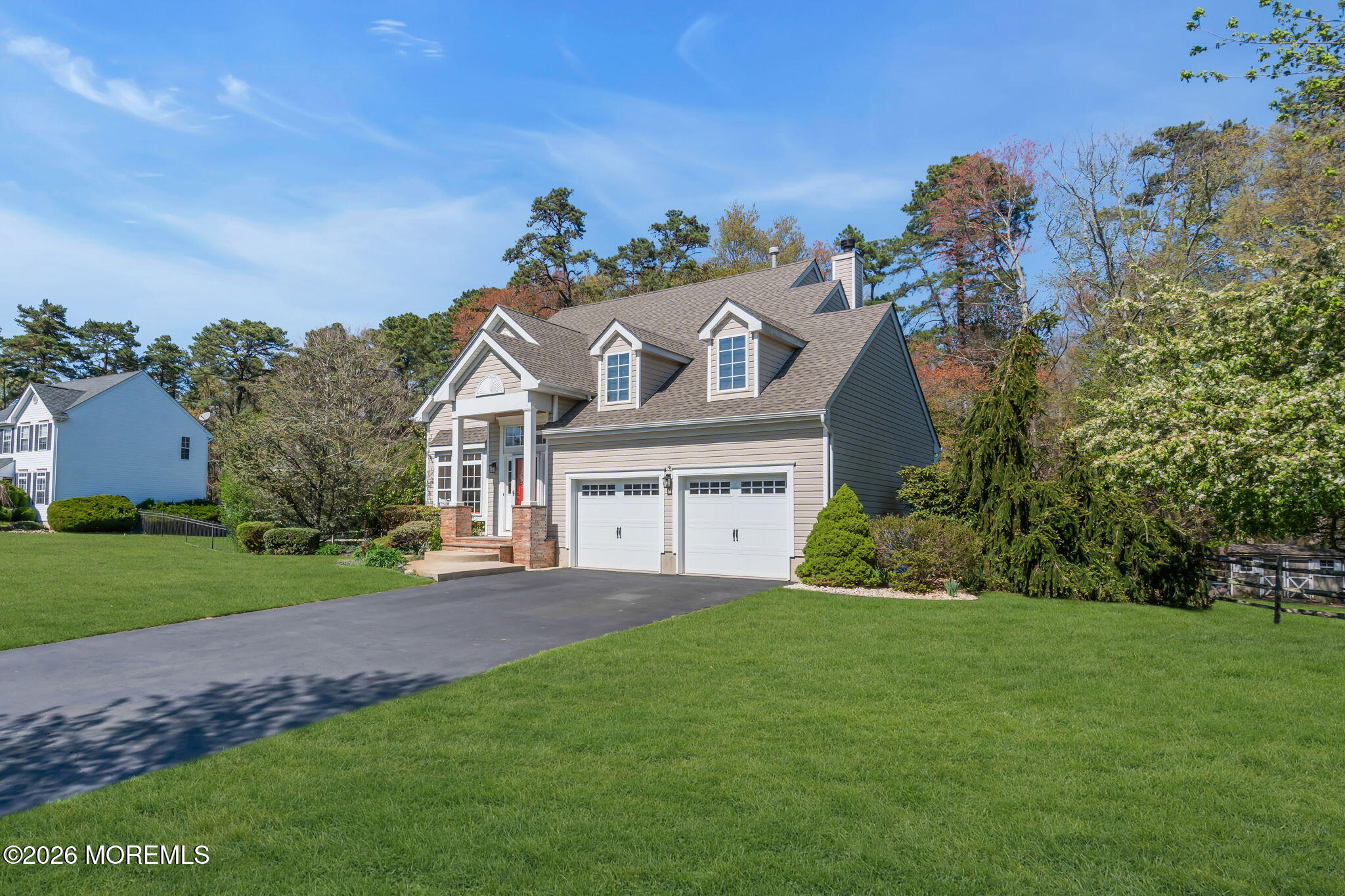 343 Nighthawk Lane Jackson, NJ 08527 - Photo 8 of 72 a front view of a house with a yard and garage