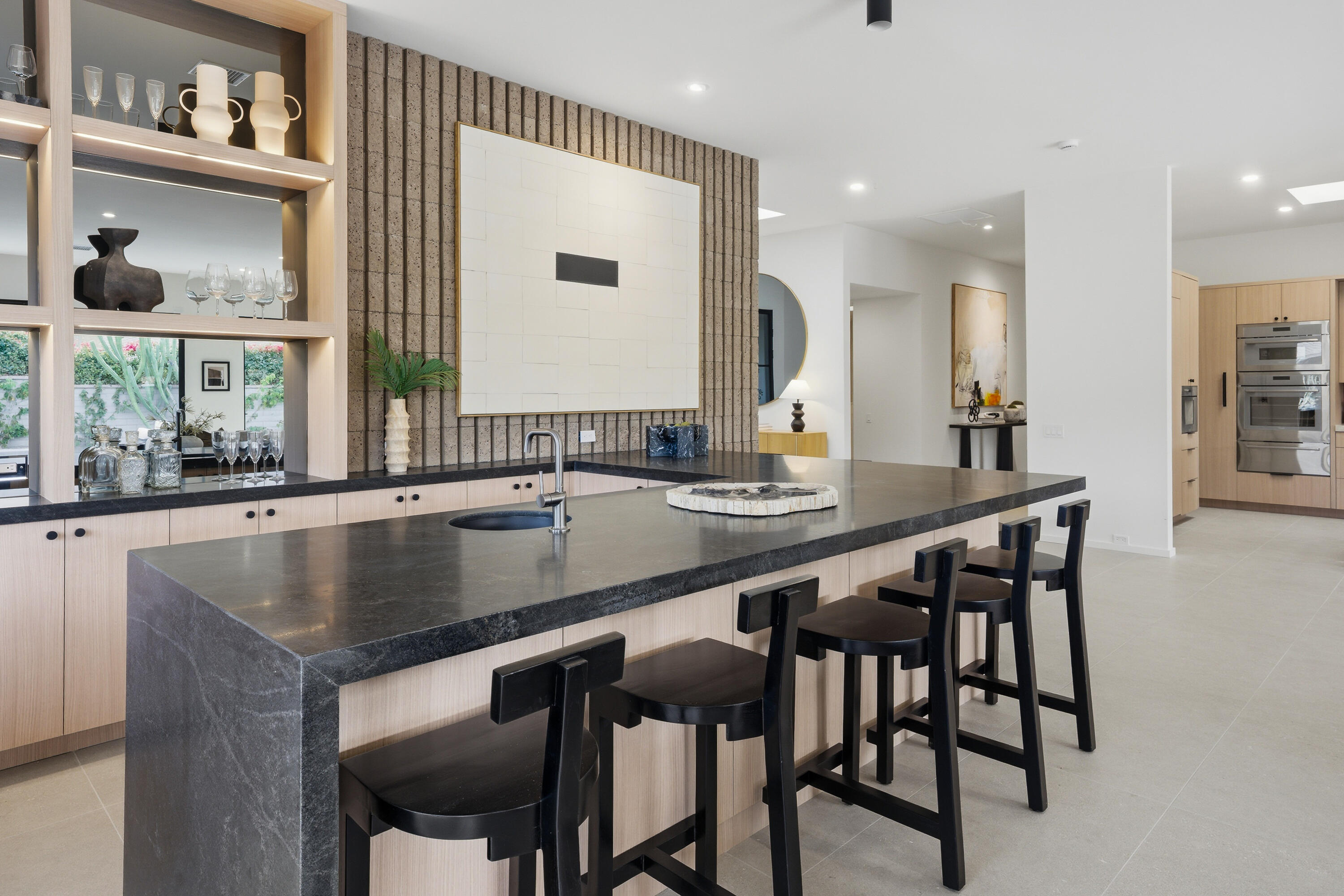 14 Rutgers Court Rancho Mirage, CA 92270 - Photo 35 of 59 a kitchen with a table chairs sink and cabinets