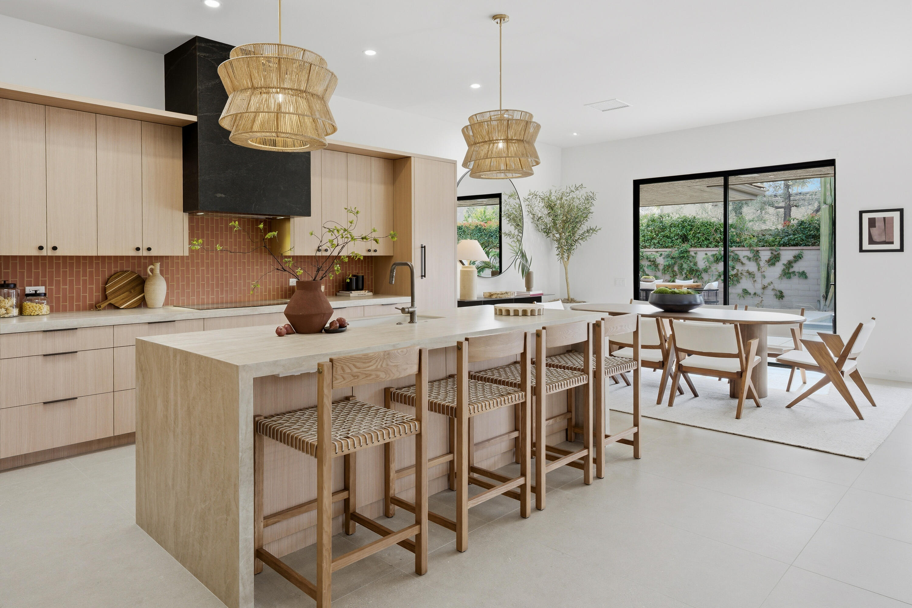 14 Rutgers Court Rancho Mirage, CA 92270 - Photo 36 of 59 a kitchen with kitchen island stainless steel appliances a table and chairs in it