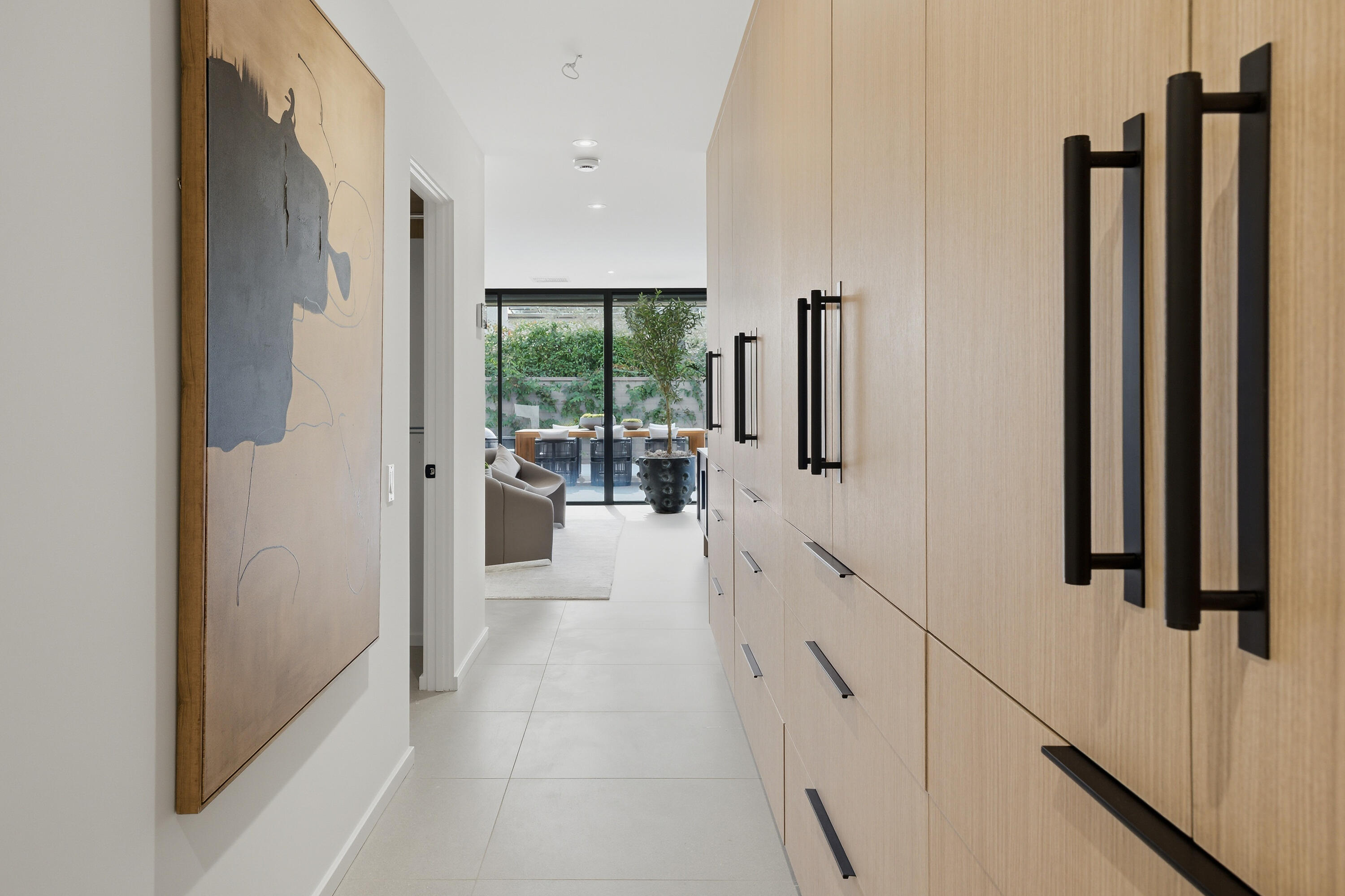 14 Rutgers Court Rancho Mirage, CA 92270 - Photo 45 of 59 a hallway with white doors wooden floor and windows