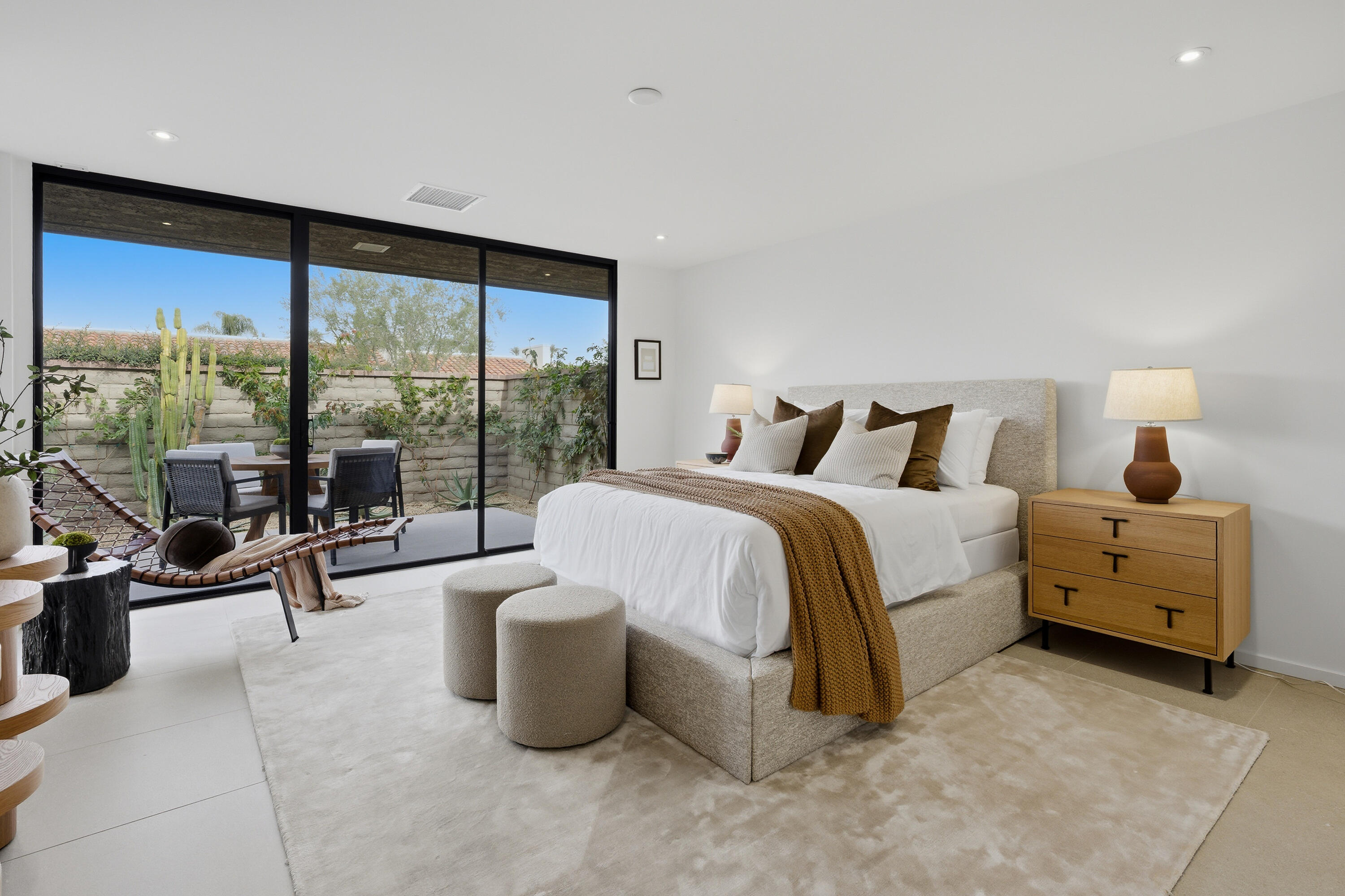 14 Rutgers Court Rancho Mirage, CA 92270 - Photo 50 of 59 a bedroom with a bed and large glass window