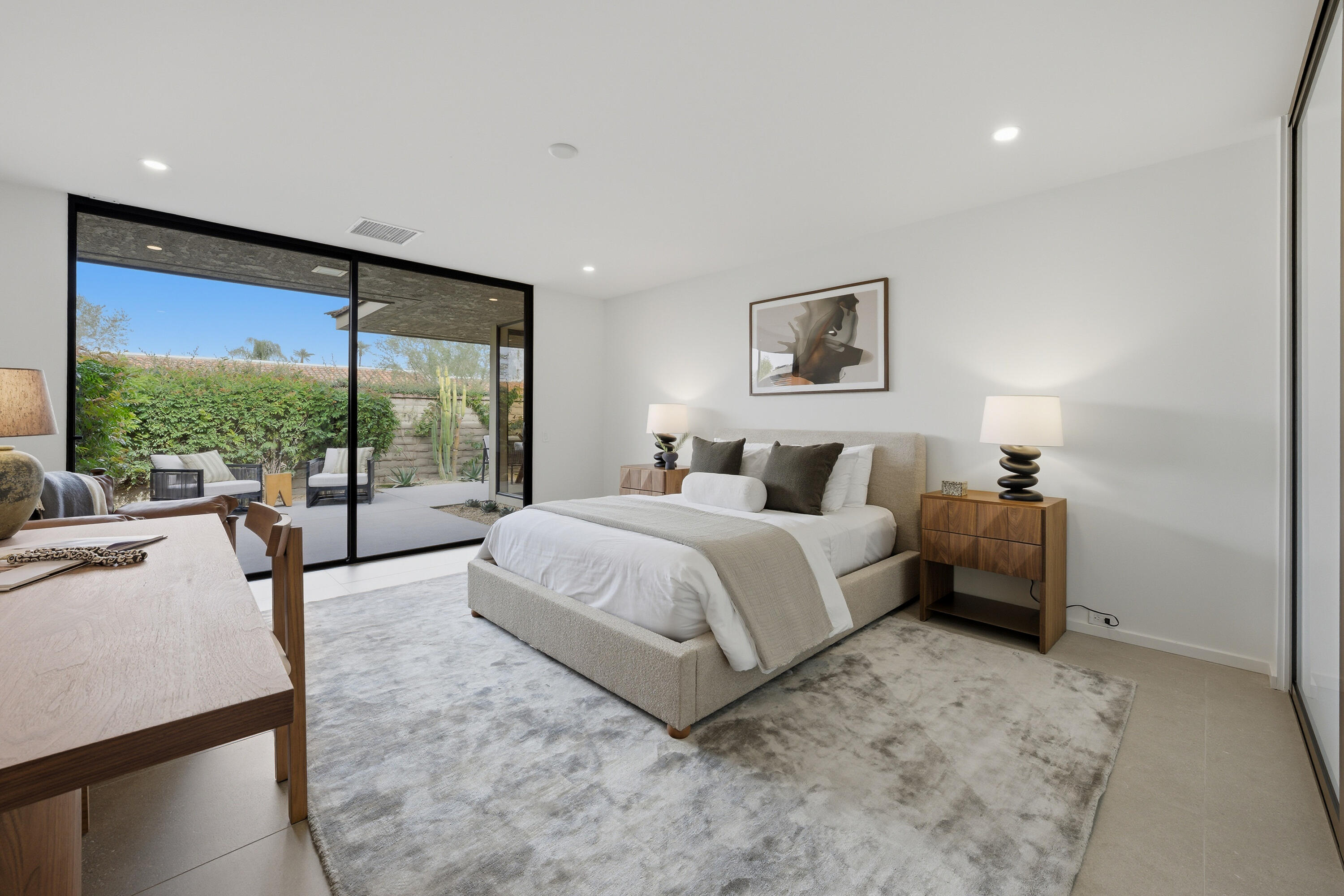 14 Rutgers Court Rancho Mirage, CA 92270 - Photo 55 of 59 a spacious bedroom with a large bed and a large window