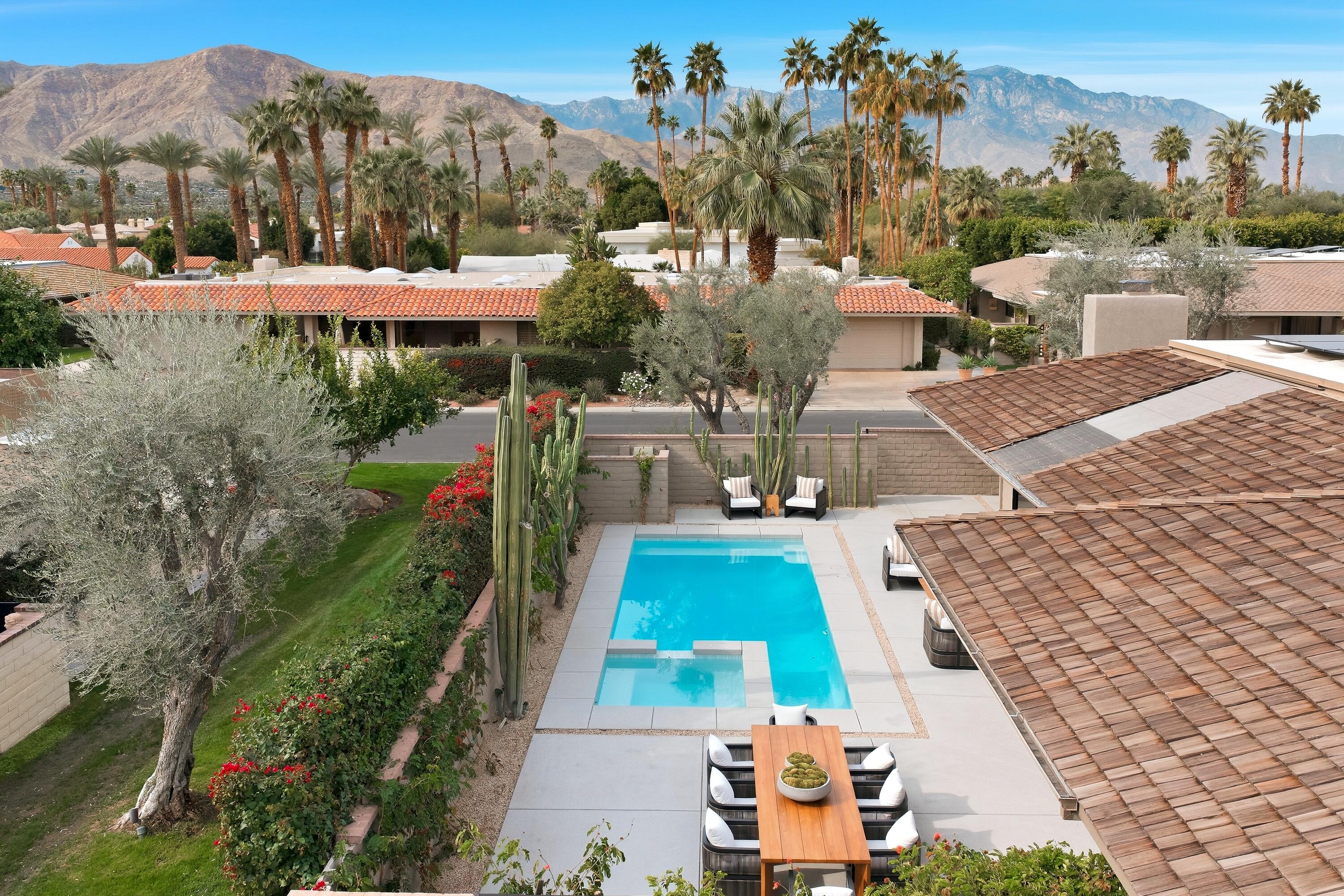 14 Rutgers Court Rancho Mirage, CA 92270 - Photo 10 of 59 a view of a swimming pool with a yard and mountain view