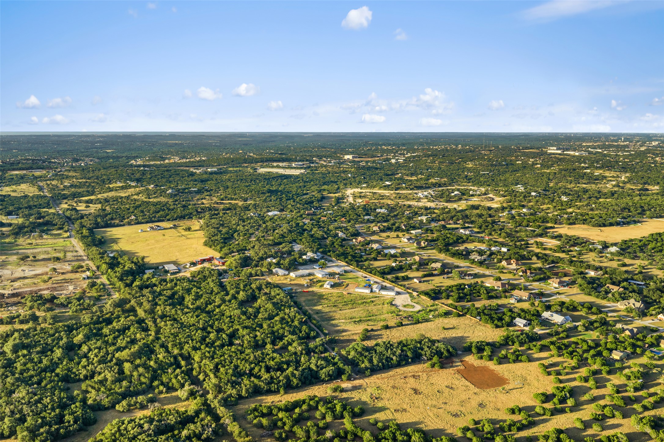 0 Hays Country Acres Road Dripping Springs, TX 78620 - Photo 6 of 33 Sweeping countryside horizons stretch as far as the eye can see under clear blue skies.