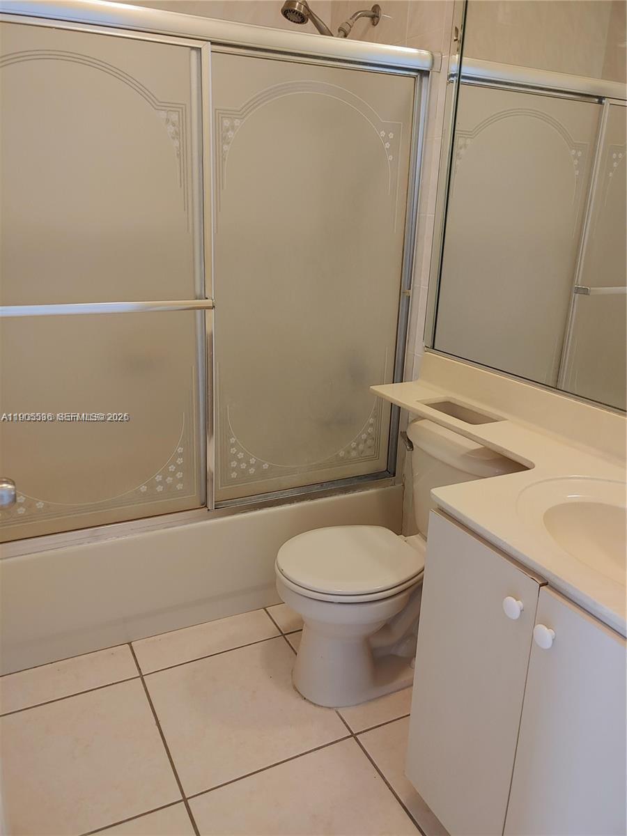 7510 Northwest 175th Street, Unit 7510 Hialeah, FL 33015 - Photo 7 of 14 a bathroom with a sink a toilet and shower