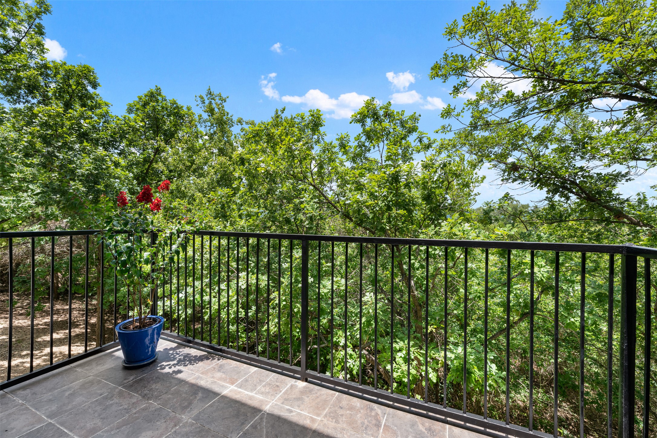 11203 Ranch Road 2222, Unit 1407 Austin, TX 78732 - Photo 5 of 40 The coveted end unit condo backs to a wooded greenbelt providing for enchanting views from your balcony and the entire interior of the townhome.