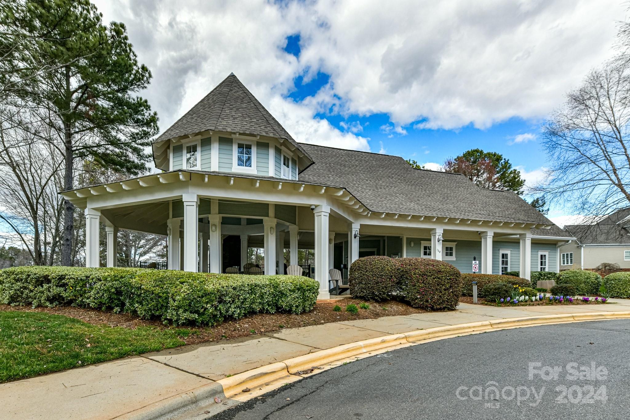 111 Poppy Field Lane Davidson, NC 28115 - Photo 25 of 28 a view of a white house with a yard and potted plants