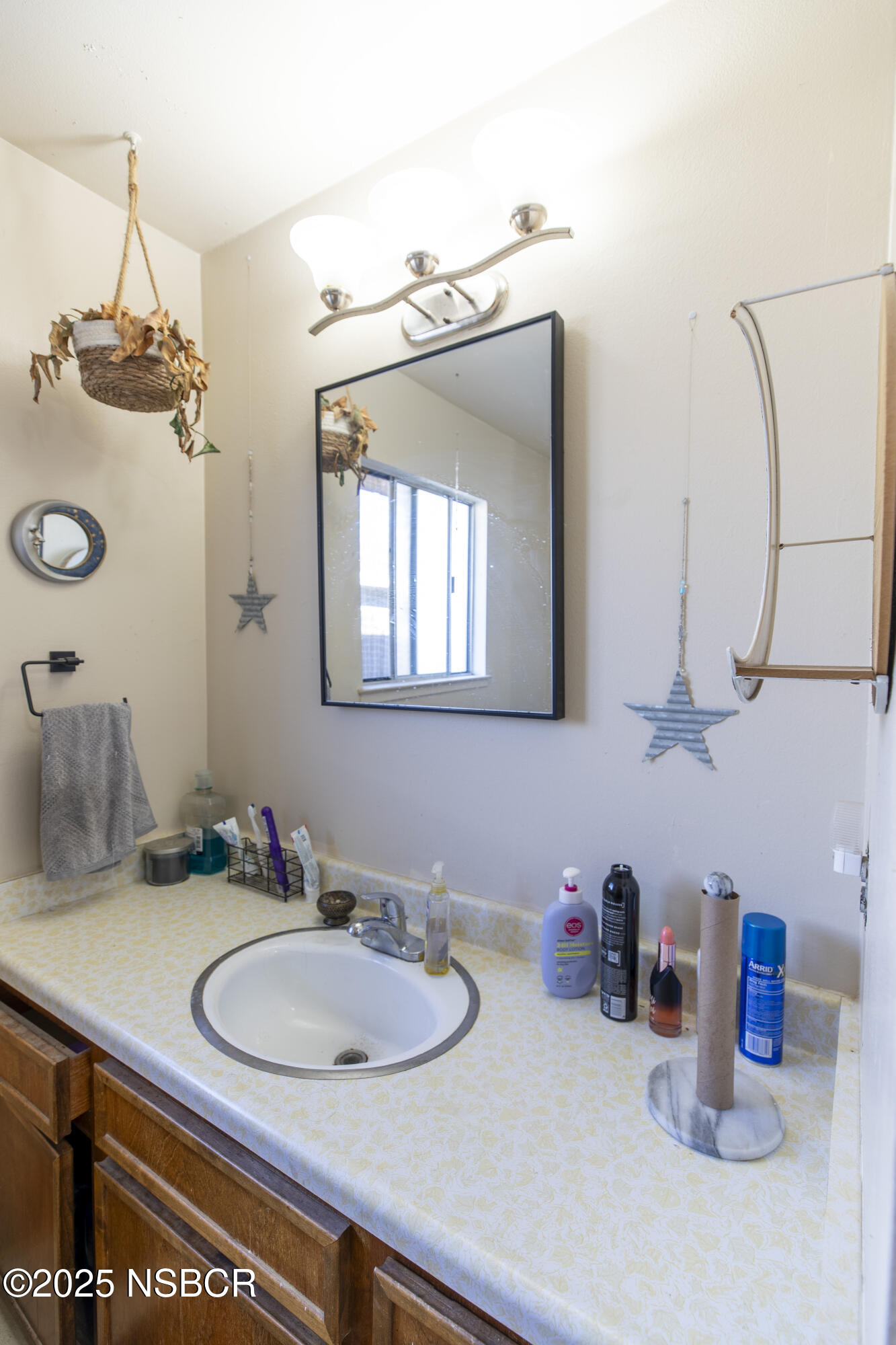 601 North Seventh Street Lompoc, CA 93436 - Photo 12 of 32 a bathroom with a sink and a mirror