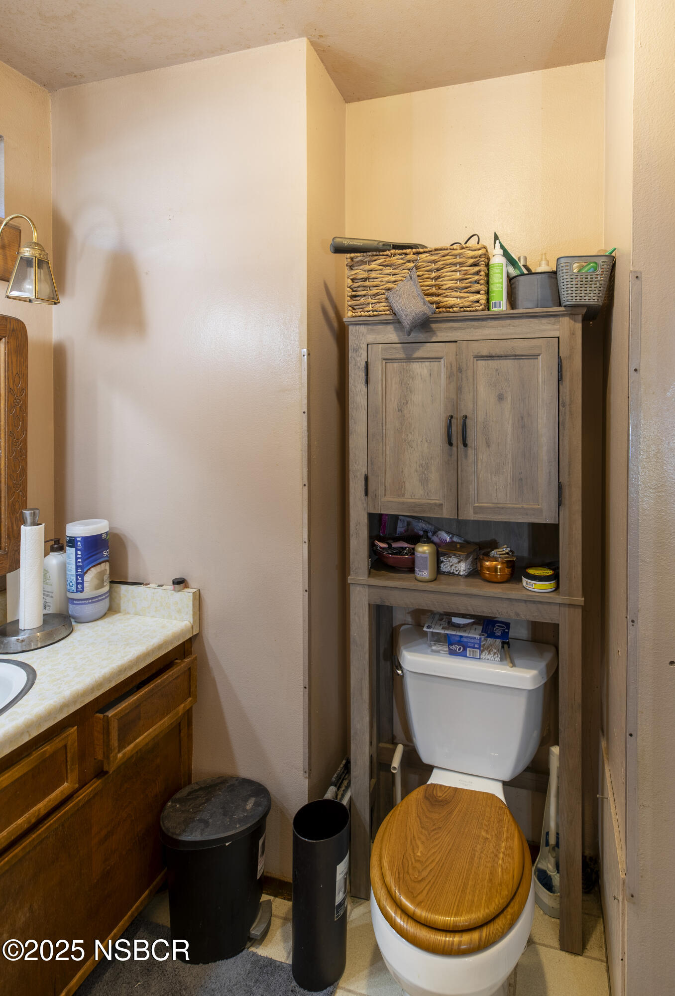 601 North Seventh Street Lompoc, CA 93436 - Photo 18 of 32 a bathroom with a toilet a sink and a mirror