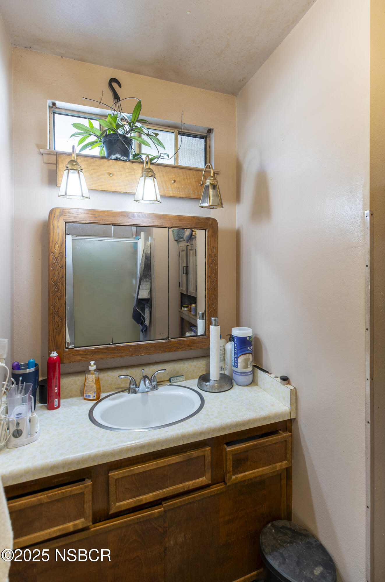 601 North Seventh Street Lompoc, CA 93436 - Photo 19 of 32 a bathroom with a sink and a mirror