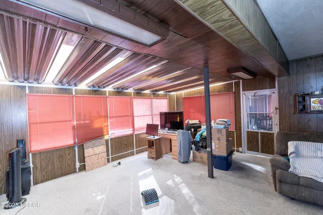 a room with furniture and a flat screen tv