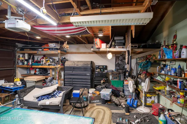 a view of a backyard with sitting area and furniture