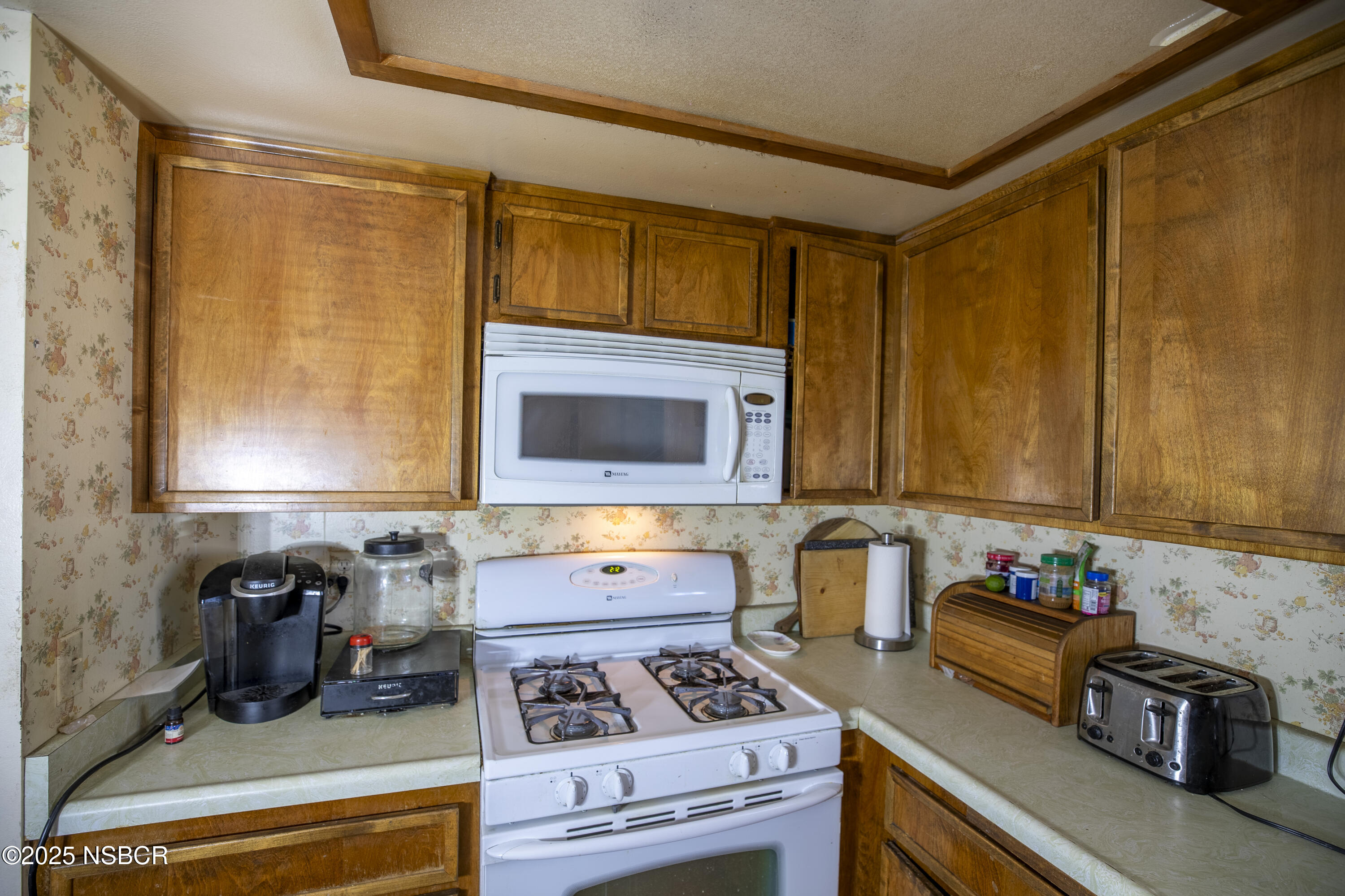 601 North Seventh Street Lompoc, CA 93436 - Photo 6 of 32 a kitchen with a refrigerator a stove and a sink