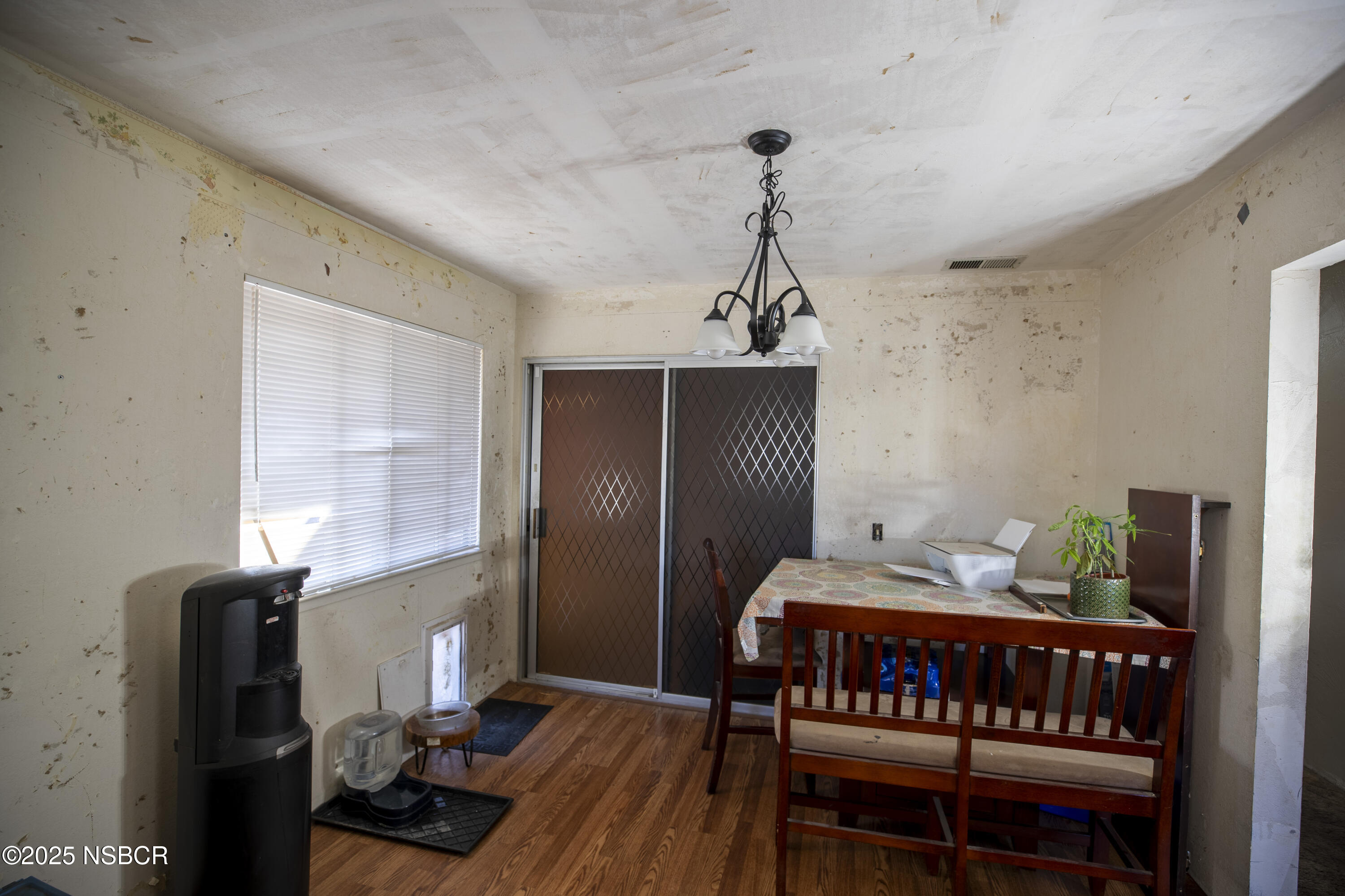 601 North Seventh Street Lompoc, CA 93436 - Photo 8 of 32 a bedroom with furniture and wooden floor