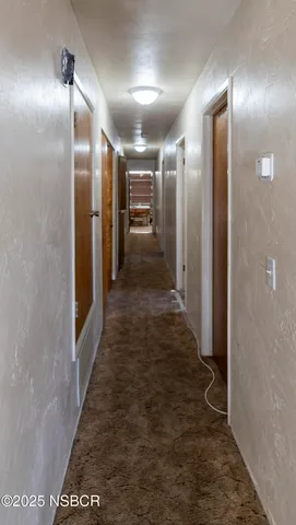 a room with a closet and a chandelier