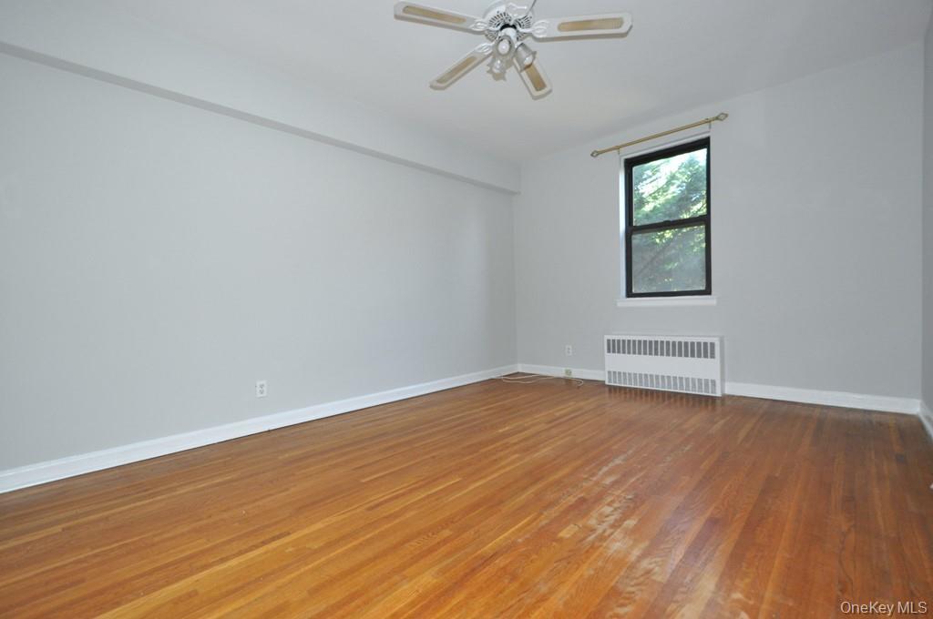142 Garth Road, Unit 2N Scarsdale, NY 10583 - Photo 14 of 32 Large corner bedroom has two closest and hardwood floors. The bedroom is 15'-4" x 11'-4".
