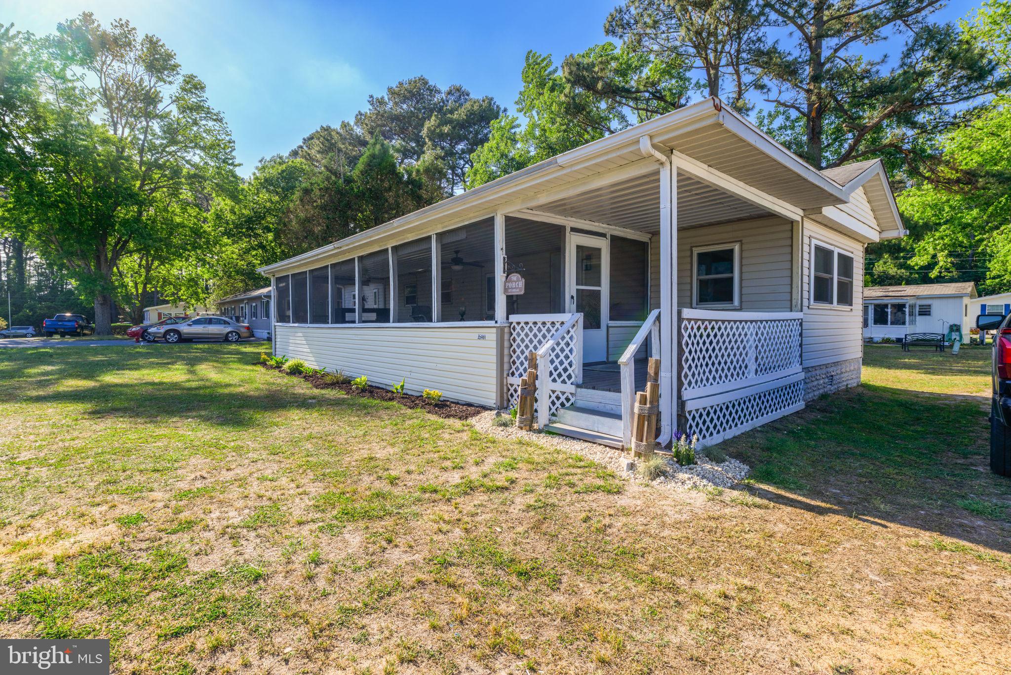35401 Mallard Road Millsboro, DE 19966 - Photo 1 of 23 a view of a house with a yard and sitting area