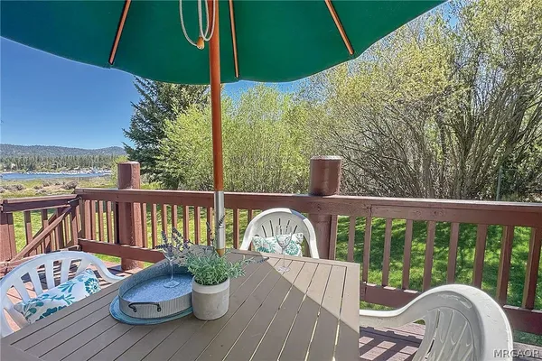 a view of a chair and table on the roof deck