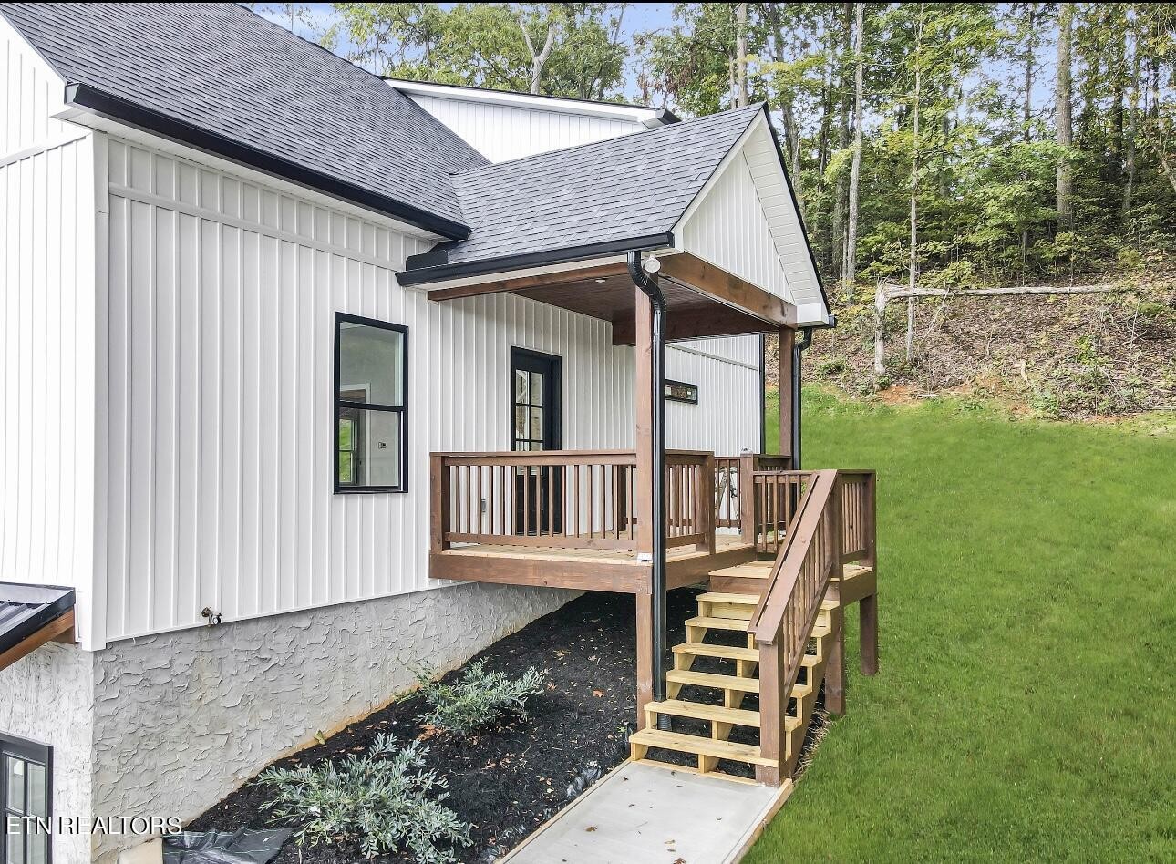 246 Clear Creek Road Kodak, TN 37764 - Photo 4 of 23 a view of a house with a yard and deck