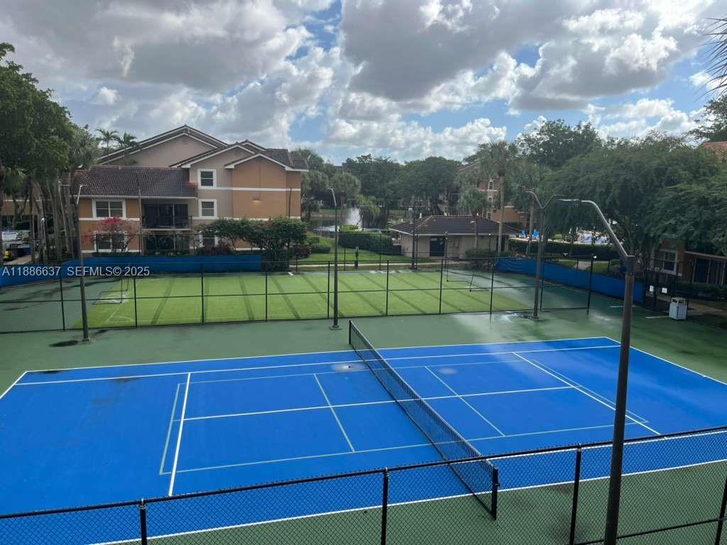 8801 Wiles Road, Unit 306 Coral Springs, FL 33067 - Photo 12 of 20 a tennis court view