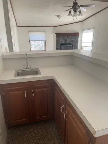 a kitchen with a sink and cabinets