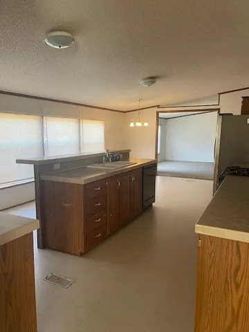 a view of a kitchen with a sink
