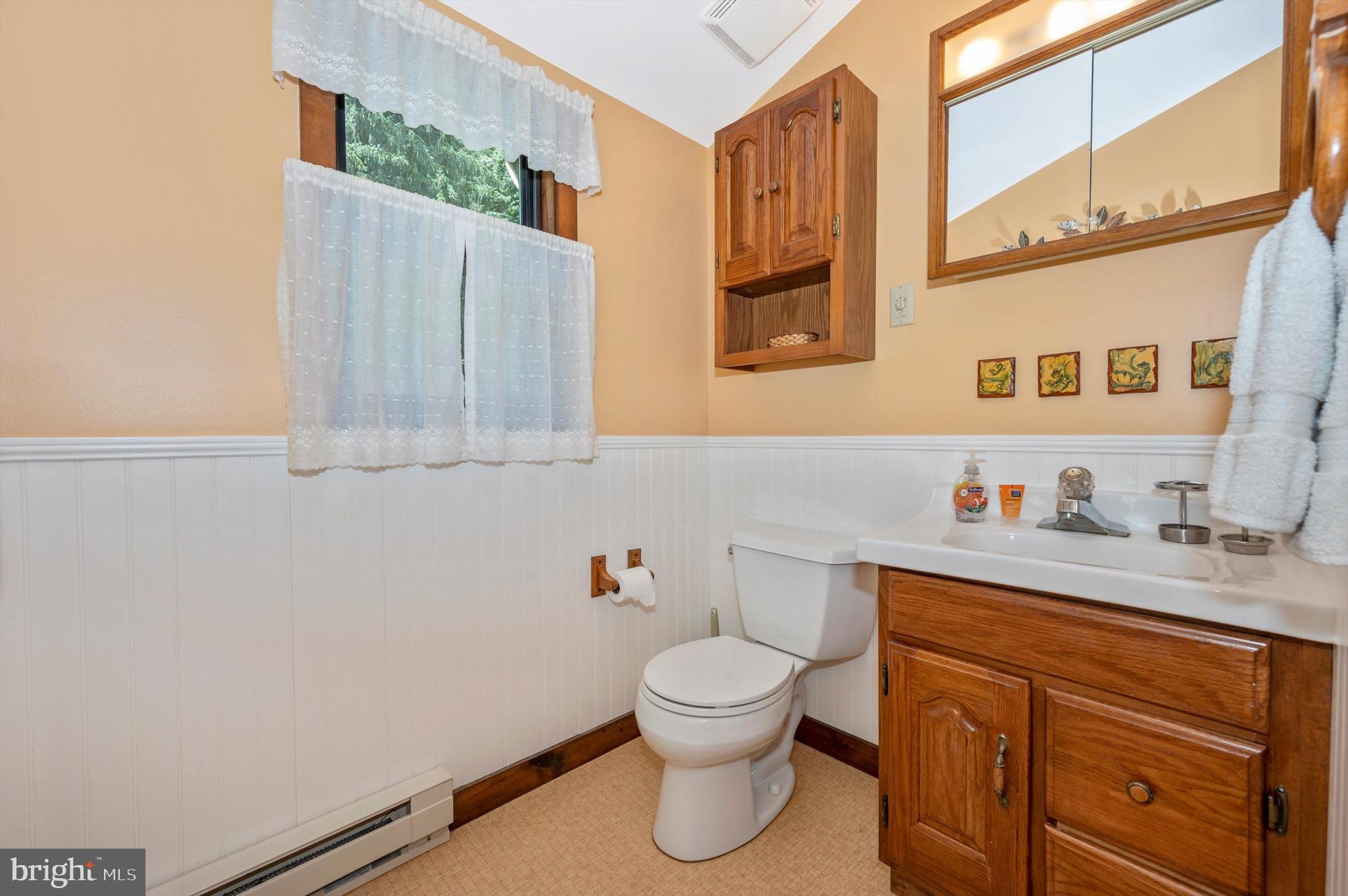 9301 Hamburg Road Frederick, MD 21702 - Photo 26 of 57 a bathroom with a toilet sink and mirror